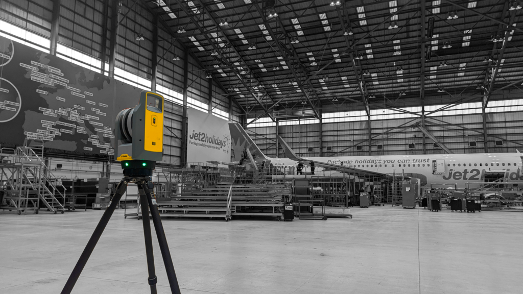 Laser scanner capturing a point cloud inside an aircraft hangar