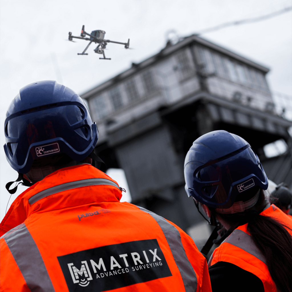 2 Matrix Advanced Surveying Employees Flighting a DJI Matrice Drone