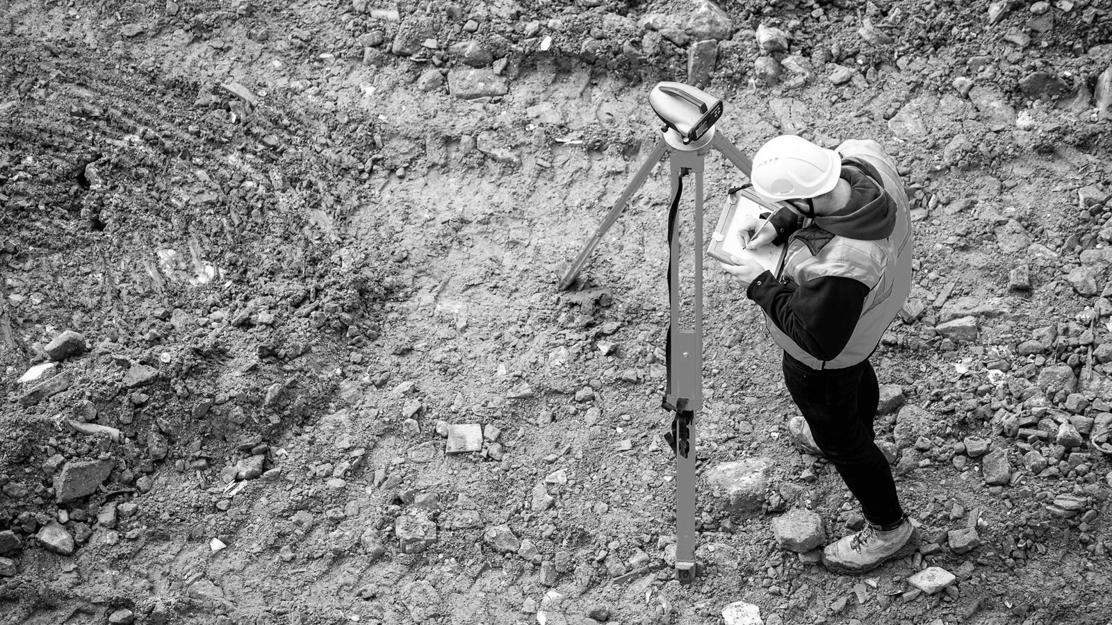 Surveyor taking readings with a GNSS receiver
