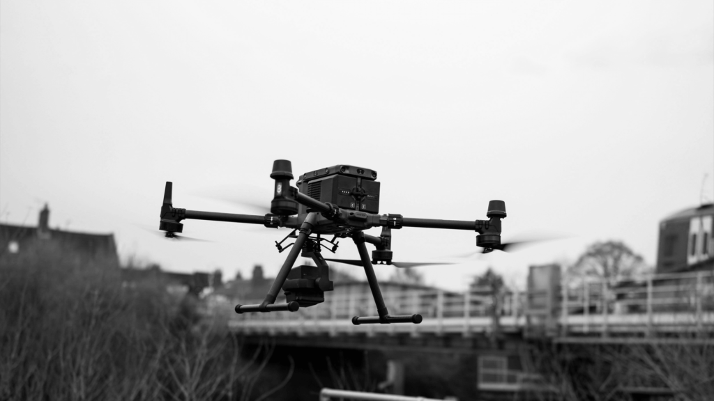Survey drone in flight over a bridge